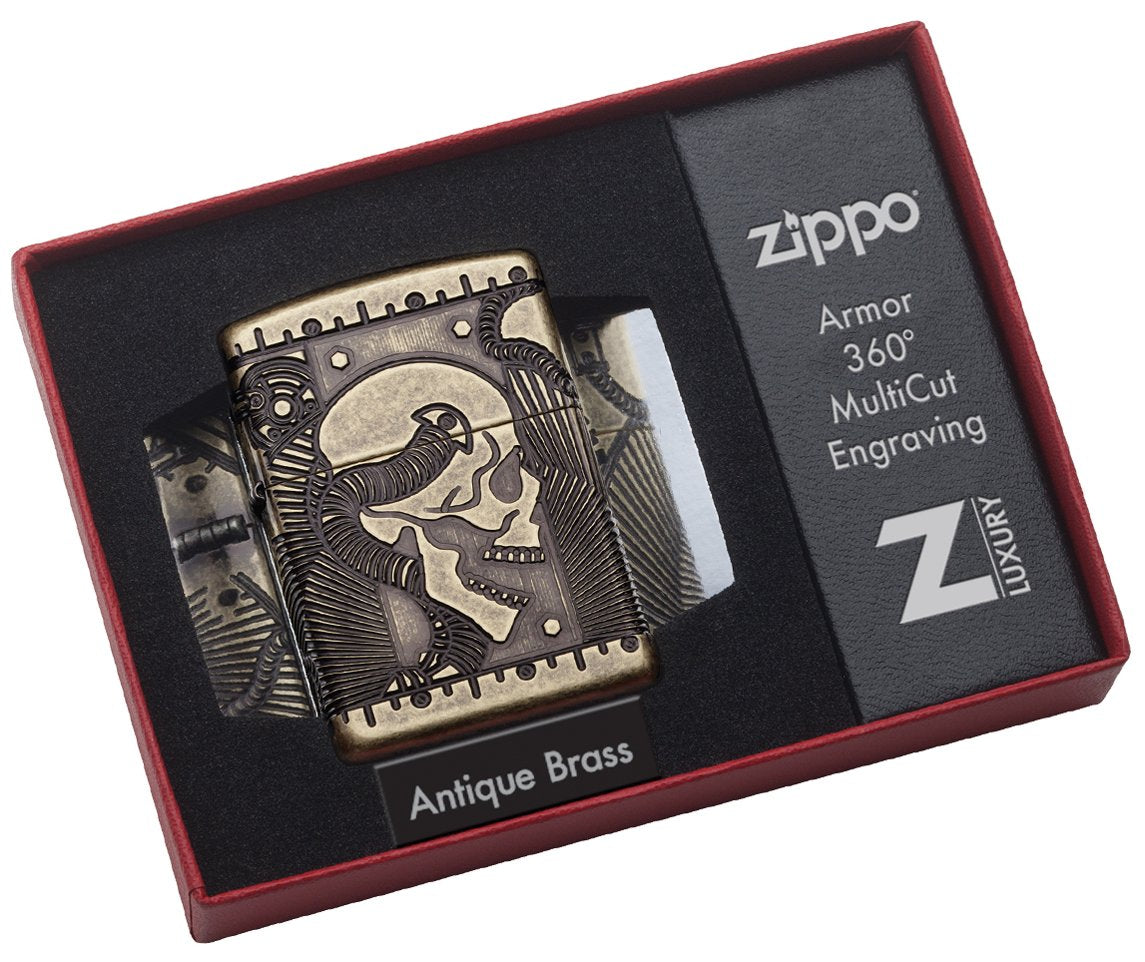 Zippo-aansteker messing antiek met diep gegraveerd doodshoofd met mechanische elementen in open luxe doos